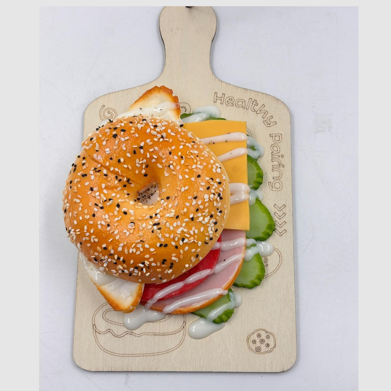 GURUBHAI EQUIPMENTS Artificial Bagel Sandwich with Cheese & Egg – Realistic Fake Food Prop with Wooden Board for Café Display, Bakery Showpiece, Photography & Restaurant Décor
